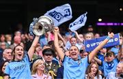 3 August 2025; Dublin players Éilish O'Dowd, left, and Chloe Darby lift the Brendan Martin Cup after the TG4 All-Ireland Ladies Football Senior Championship final match between Dublin and Meath at Croke Park in Dublin. Photo by Piaras Ó Mídheach/Sportsfile