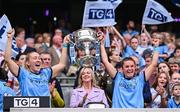 3 August 2025; Dublin players Jodi Egan, left, and Kate Sullivan lift the Brendan Martin Cup after the TG4 All-Ireland Ladies Football Senior Championship final match between Dublin and Meath at Croke Park in Dublin. Photo by Piaras Ó Mídheach/Sportsfile