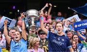 3 August 2025; Dublin players Rebecca McDonnell, left, and Katie Moran Tighe lift the Brendan Martin Cup after the TG4 All-Ireland Ladies Football Senior Championship final match between Dublin and Meath at Croke Park in Dublin. Photo by Piaras Ó Mídheach/Sportsfile