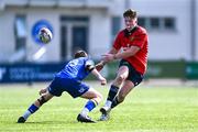 13 August 2025; Ryan McCormack of Munster in action against Tommy Smyth of Leinster during the PwC U-18 Boys Interprovincial Series match between Leinster and Munster at Energia Park in Dublin. Photo by Tyler Miller/Sportsfile