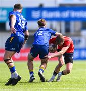13 August 2025; Daniel Murphy of Munster is tackled by Nic Sheehan of Leinster during the PwC U-18 Boys Interprovincial Series match between Leinster and Munster at Energia Park in Dublin. Photo by Tyler Miller/Sportsfile