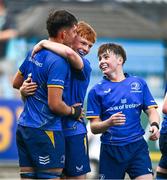 13 August 2025; Michael Kenny of Leinster, centre, and team-mate Eoin Farrell celebrate after the PwC U-18 Boys Interprovincial Series match between Leinster and Munster at Energia Park in Dublin. Photo by Tyler Miller/Sportsfile