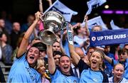 3 August 2025; Dublin players, from left, Niamh Hetherton, Hannah Leahy and Caoimhe O'Connor lift the Brendan Martin Cup after their side's victory in the TG4 All-Ireland Ladies Football Senior Championship final match between Dublin and Meath at Croke Park in Dublin. Photo by Piaras Ó Mídheach/Sportsfile