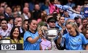 3 August 2025; Dublin players Annabelle Timothy, left, and Aoife Curran of Dublin with the Brendan Martin Cup after the TG4 All-Ireland Ladies Football Senior Championship final match between Dublin and Meath at Croke Park in Dublin. Photo by Piaras Ó Mídheach/Sportsfile