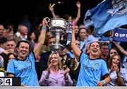 3 August 2025; Dublin players Leah Caffrey, left, and Martha Byrne lift the Brendan Martin Cup after the TG4 All-Ireland Ladies Football Senior Championship final match between Dublin and Meath at Croke Park in Dublin. Photo by Piaras Ó Mídheach/Sportsfile