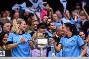3 August 2025; Dublin players Nicole Owens, left, and Sinéad Goldrick celebrate with the Brendan Martin Cup after the TG4 All-Ireland Ladies Football Senior Championship final match between Dublin and Meath at Croke Park in Dublin. Photo by Piaras Ó Mídheach/Sportsfile