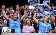 3 August 2025; Dublin players Rachel Hartnett, left, and Jess Tobin lift the Brendan Martin Cup after the TG4 All-Ireland Ladies Football Senior Championship final match between Dublin and Meath at Croke Park in Dublin. Photo by Piaras Ó Mídheach/Sportsfile