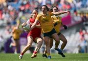 3 August 2025; Kate Flood of Louth in action against Bronagh Devlin of Antrim during the TG4 All-Ireland Ladies Football Junior Championship final match between Antrim and Louth at Croke Park in Dublin. Photo by Piaras Ó Mídheach/Sportsfile