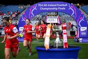 3 August 2025; Louth players run past The West County Hotel cup before the TG4 All-Ireland Ladies Football Junior Championship final match between Antrim and Louth at Croke Park in Dublin. Photo by Piaras Ó Mídheach/Sportsfile