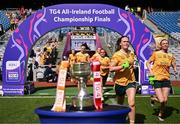 3 August 2025; Antrim players run past The West County Hotel cup before the TG4 All-Ireland Ladies Football Junior Championship final match between Antrim and Louth at Croke Park in Dublin. Photo by Piaras Ó Mídheach/Sportsfile
