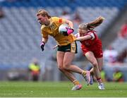 3 August 2025; Carla McKenna of Antrim in action against Seoda Matthews of Louth during the TG4 All-Ireland Ladies Football Junior Championship final match between Antrim and Louth at Croke Park in Dublin. Photo by Piaras Ó Mídheach/Sportsfile
