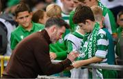 14 August 2025; Shamrock Rovers manager Stephen Bradley with a young supporter before the UEFA Conference League Third Qualifying Round second leg match between Shamrock Rovers and Ballkani at Tallaght Stadium in Dublin. Photo by Stephen McCarthy/Sportsfile