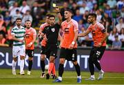 14 August 2025; Referee Mohammad Al-Emara shows a yellow to Gentrit Halili of Ballkani, 4, during the UEFA Conference League Third Qualifying Round second leg match between Shamrock Rovers and Ballkani at Tallaght Stadium in Dublin. Photo by Ben McShane/Sportsfile
