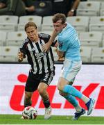 14 August 2025; Conor Carty of St Patrick's Athletic in action against Jonas Svensson of Besiktas during the UEFA Conference League Third Qualifying Round second leg match between Besiktas and St Patrick's Athletic at Besiktas Stadium in Istanbul, Türkiye. Photo by Emre Oktay/Sportsfile