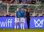 14 August 2025; Shamrock Rovers manager Stephen Bradley speaks with substitutes Michael Noonan, left, and Graham Burke during the UEFA Conference League Third Qualifying Round second leg match between Shamrock Rovers and Ballkani at Tallaght Stadium in Dublin. Photo by Stephen McCarthy/Sportsfile