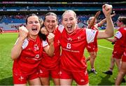 3 August 2025; Louth players, from left, Emma Gartlan, Holly Lambe Sally and Victoria Fee celebrate after the TG4 All-Ireland Ladies Football Junior Championship final match between Antrim and Louth at Croke Park in Dublin. Photo by Piaras Ó Mídheach/Sportsfile