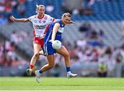3 August 2025; Fiona Dooley of Laois in action against Aoife Horisk of Tyrone during the TG4 All-Ireland Ladies Football Intermediate Championship final match between Laois and Tyrone at Croke Park in Dublin. Photo by Piaras Ó Mídheach/Sportsfile