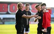 15 August 2025; James McManus of Sligo Rovers, right, who is on loan from Bohemians, with Bohemians players, from left, James Talbot, Kacper Chorazka, and Archie Meekison, before the Sports Direct Men’s FAI Cup third round match between Bohemians and Sligo Rovers at Dalymount Park in Dublin. Photo by Seb Daly/Sportsfile