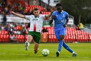 15 August 2025; James Olayinka of Waterford shoots on goal despite pressure from Darragh Crowley of Cork Cty during the Sports Direct Men’s FAI Cup third round match between Cork City and Waterford at Turner's Cross in Cork. Photo by Tyler Miller/Sportsfile