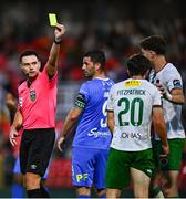 15 August 2025; Referee Rob Hennessy shows a yellow card to Josh Fitzpatrick of Cork City during the Sports Direct Men’s FAI Cup third round match between Cork City and Waterford at Turner's Cross in Cork. Photo by Tyler Miller/Sportsfile