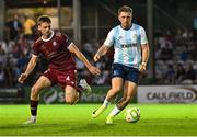 15 August 2025; Cole Connolly of Salthill Devon in action against Killian Brouder of Galway United during the Sports Direct Men’s FAI Cup third round match between Salthill Devon and Galway United at Eamonn Deacy Park in Galway. Photo by Piaras Ó Mídheach/Sportsfile