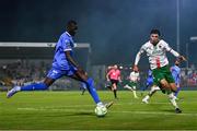 15 August 2025; Muhammadu Faal of Waterford in action against Freddie Anderson of Cork City during the Sports Direct Men’s FAI Cup third round match between Cork City and Waterford at Turner's Cross in Cork. Photo by Tyler Miller/Sportsfile