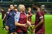 15 August 2025; Jeremy Sivi of Galway United with his manager John Caulfield after his side's victory in the Sports Direct Men’s FAI Cup third round match between Salthill Devon and Galway United at Eamonn Deacy Park in Galway. Photo by Piaras Ó Mídheach/Sportsfile