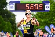16 August 2025; Ann Marie McGlynn of Strabane AC crosses the line to win the women's race during the Irish Life Dublin Race Series Frank Duffy 10 Mile in Phoenix Park, Dublin. Photo by Seb Daly/Sportsfile