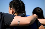 16 August 2025; The tattoo of Nikki Caughey of Leinster reads Mná, the irish word for woman, before the Vodafone Women’s Interprovincial Championship Round 2 match between Leinster and Munster at Energia Park in Dublin. Photo by Shauna Clinton/Sportsfile