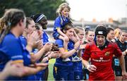 16 August 2025; Leinster players, including Aoife Moore, centre, and Ellie Martin, daugher of Leinster head coach Ben Martin applaud as Munster players leave the pitch after the Vodafone Women’s Interprovincial Championship Round 2 match between Leinster and Munster at Energia Park in Dublin. Photo by Shauna Clinton/Sportsfile