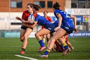 16 August 2025; Alice O'Donovan of Munster is tackled by Rebecca Cahill of Leinster during the PwC U-18 Girls Interprovincial Series match between Leinster and Munster at Energia Park in Dublin. Photo by Shauna Clinton/Sportsfile