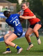 16 August 2025; Abi Kelly of Munster is tackled by Sloane Rangitaawa of Leinster during the PwC U-18 Girls Interprovincial Series match between Leinster and Munster at Energia Park in Dublin. Photo by Shauna Clinton/Sportsfile