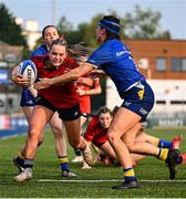 16 August 2025; Abi Kelly of Munster is tackled by Katieanne Bobbett of Leinster during the PwC U-18 Girls Interprovincial Series match between Leinster and Munster at Energia Park in Dublin. Photo by Shauna Clinton/Sportsfile
