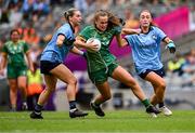 3 August 2025; Emma Duggan of Meath in action against Martha Byrne, left, and Niamh Donlon of Dublin during the TG4 All-Ireland Ladies Football Senior Championship final match between Dublin and Meath at Croke Park in Dublin. Photo by Piaras Ó Mídheach/Sportsfile