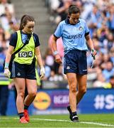 3 August 2025; Hannah Tyrrell of Dublin leaves the pitch to receive medical attention for an injury during the TG4 All-Ireland Ladies Football Senior Championship final match between Dublin and Meath at Croke Park in Dublin. Photo by Piaras Ó Mídheach/Sportsfile