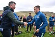 4 August 2025; GAA National Head of Hurling Willie Maher presents a sliotar to Noel Fallon of Roscommon before the M. Donnelly GAA Poc Fada All-Ireland Finals at Annaverna Mountain in the Cooley Peninsula, Ravensdale, Louth. Photo by Piaras Ó Mídheach/Sportsfile