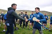 4 August 2025; GAA National Head of Hurling Willie Maher presents a sliotar to Cillian Kiely of Offaly before the M. Donnelly GAA Poc Fada All-Ireland Finals at Annaverna Mountain in the Cooley Peninsula, Ravensdale, Louth. Photo by Piaras Ó Mídheach/Sportsfile