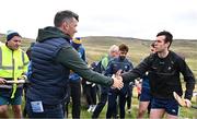 4 August 2025; GAA National Head of Hurling Willie Maher presents a sliotar to Darren Geoghegan of Louth before the M. Donnelly GAA Poc Fada All-Ireland Finals at Annaverna Mountain in the Cooley Peninsula, Ravensdale, Louth. Photo by Piaras Ó Mídheach/Sportsfile