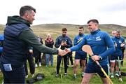 4 August 2025; GAA National Head of Hurling Willie Maher presents a sliotar to Killian Phelan of Kilkenny before the M. Donnelly GAA Poc Fada All-Ireland Finals at Annaverna Mountain in the Cooley Peninsula, Ravensdale, Louth. Photo by Piaras Ó Mídheach/Sportsfile