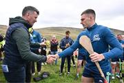 4 August 2025; GAA National Head of Hurling Willie Maher presents a sliotar to Seán Óg McLaren of Antrim before the M. Donnelly GAA Poc Fada All-Ireland Finals at Annaverna Mountain in the Cooley Peninsula, Ravensdale, Louth. Photo by Piaras Ó Mídheach/Sportsfile