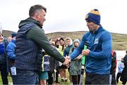 4 August 2025; GAA National Head of Hurling Willie Maher presents a sliotar to Fionan Mackessy of Kilkenny before the M. Donnelly GAA Poc Fada All-Ireland Finals at Annaverna Mountain in the Cooley Peninsula, Ravensdale, Louth. Photo by Piaras Ó Mídheach/Sportsfile