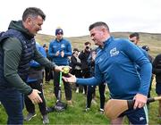 4 August 2025; GAA National Head of Hurling Willie Maher presents a sliotar to Pat Burke of Westmeath before the M. Donnelly GAA Poc Fada All-Ireland Finals at Annaverna Mountain in the Cooley Peninsula, Ravensdale, Louth. Photo by Piaras Ó Mídheach/Sportsfile