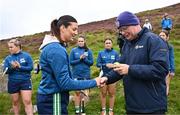 4 August 2025; Camogie President Brian Molloy presents a sliotar to Ellen Leech of Antrim before the M. Donnelly GAA Poc Fada All-Ireland Finals at Annaverna Mountain in the Cooley Peninsula, Ravensdale, Louth. Photo by Piaras Ó Mídheach/Sportsfile