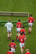 26 September 2004; Mayo players make their way to the bench for the team photograph. Bank of Ireland All-Ireland Senior Football Championship Final, Kerry v Mayo, Croke Park, Dublin. Picture credit; Pat Murphy / SPORTSFILE *** Local Caption *** Any photograph taken by SPORTSFILE during, or in connection with, the 2004 Bank of Ireland All-Ireland Senior Football Final which displays GAA logos or contains an image or part of an image of any GAA intellectual property, or, which contains images of a GAA player/players in their playing uniforms, may only be used for editorial and non-advertising purposes.  Use of photographs for advertising, as posters or for purchase separately is strictly prohibited unless prior written approval has been obtained from the Gaelic Athletic Association.