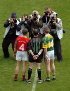 26 September 2004; Mayo captain Gary Ruane and Kerry captain Dara O Cinneide stand for a picture with referee Pat McEnaney before the game. Bank of Ireland All-Ireland Senior Football Championship Final, Kerry v Mayo, Croke Park, Dublin. Picture credit; Pat Murphy / SPORTSFILE *** Local Caption *** Any photograph taken by SPORTSFILE during, or in connection with, the 2004 Bank of Ireland All-Ireland Senior Football Final which displays GAA logos or contains an image or part of an image of any GAA intellectual property, or, which contains images of a GAA player/players in their playing uniforms, may only be used for editorial and non-advertising purposes.  Use of photographs for advertising, as posters or for purchase separately is strictly prohibited unless prior written approval has been obtained from the Gaelic Athletic Association.