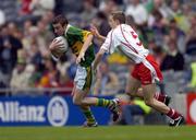 26 September 2004; Rory Keating, Kerry, in action against John Gilmore, Tyrone. All-Ireland Minor Football Championship Final, Kerry v Tyrone, Croke Park, Dublin. Picture credit; Ray McManus / SPORTSFILE *** Local Caption *** Any photograph taken by SPORTSFILE during, or in connection with, the 2004 All-Ireland Minor Football Final which displays GAA logos or contains an image or part of an image of any GAA intellectual property, or, which contains images of a GAA player/players in their playing uniforms, may only be used for editorial and non-advertising purposes.  Use of photographs for advertising, as posters or for purchase separately is strictly prohibited unless prior written approval has been obtained from the Gaelic Athletic Association.
