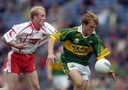 26 September 2004; Darren O'Sullivan, Kerry, in action against Martin Murray, Tyrone. All-Ireland Minor Football Championship Final, Kerry v Tyrone, Croke Park, Dublin. Picture credit; Ray McManus / SPORTSFILE *** Local Caption *** Any photograph taken by SPORTSFILE during, or in connection with, the 2004 All-Ireland Minor Football Final which displays GAA logos or contains an image or part of an image of any GAA intellectual property, or, which contains images of a GAA player/players in their playing uniforms, may only be used for editorial and non-advertising purposes.  Use of photographs for advertising, as posters or for purchase separately is strictly prohibited unless prior written approval has been obtained from the Gaelic Athletic Association.