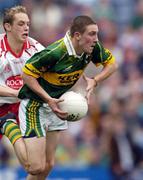 26 September 2004; Andrew Kennelly, Kerry, in action against John Gilmore, Tyrone. All-Ireland Minor Football Championship Final, Kerry v Tyrone, Croke Park, Dublin. Picture credit; Ray McManus / SPORTSFILE *** Local Caption *** Any photograph taken by SPORTSFILE during, or in connection with, the 2004 All-Ireland Minor Football Final which displays GAA logos or contains an image or part of an image of any GAA intellectual property, or, which contains images of a GAA player/players in their playing uniforms, may only be used for editorial and non-advertising purposes.  Use of photographs for advertising, as posters or for purchase separately is strictly prohibited unless prior written approval has been obtained from the Gaelic Athletic Association.