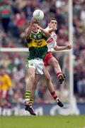 26 September 2004; David Culloty, Kerry, in action against John Kelly, Tyrone. All-Ireland Minor Football Championship Final, Kerry v Tyrone, Croke Park, Dublin. Picture credit; Ray McManus / SPORTSFILE *** Local Caption *** Any photograph taken by SPORTSFILE during, or in connection with, the 2004 All-Ireland Minor Football Final which displays GAA logos or contains an image or part of an image of any GAA intellectual property, or, which contains images of a GAA player/players in their playing uniforms, may only be used for editorial and non-advertising purposes.  Use of photographs for advertising, as posters or for purchase separately is strictly prohibited unless prior written approval has been obtained from the Gaelic Athletic Association.