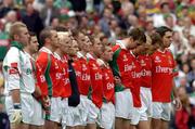 26 September 2004; The Mayo players stand for the national anthem. Bank of Ireland All-Ireland Senior Football Championship Final, Kerry v Mayo, Croke Park, Dublin. Picture credit; Ray McManus / SPORTSFILE *** Local Caption *** Any photograph taken by SPORTSFILE during, or in connection with, the 2004 Bank of Ireland All-Ireland Senior Football Final which displays GAA logos or contains an image or part of an image of any GAA intellectual property, or, which contains images of a GAA player/players in their playing uniforms, may only be used for editorial and non-advertising purposes.  Use of photographs for advertising, as posters or for purchase separately is strictly prohibited unless prior written approval has been obtained from the Gaelic Athletic Association.
